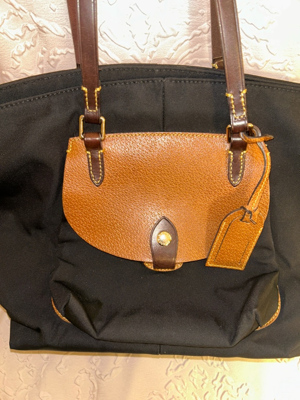 Dooney & Bourke Black Tote Bag with Brown Leather Flap and Handles